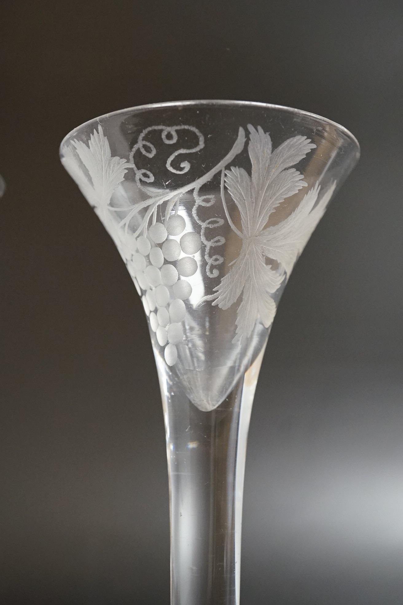 Two 18th century glass wine flutes, one with folded foot, tallest 16cm high